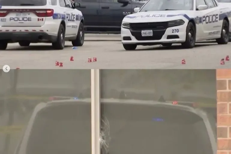 موقع الحادث الذي وقع في برامبتون، كندا، يظهر سيارات الشرطة وعلامات تشير إلى إطلاق نار، مما يعكس تصاعد العنف المرتبط بعصابة بيشنوي.